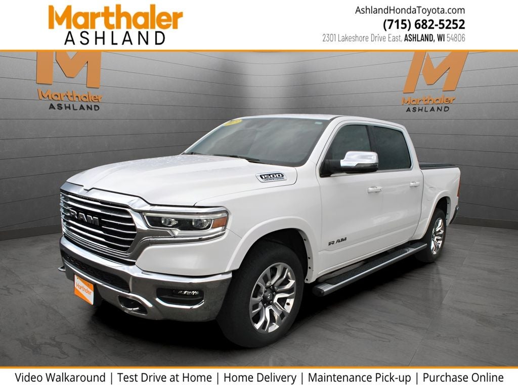 2023 RAM 1500 Limited Crew Cab 4x4 5.7L HEMI in Ivory White Tri-Coat Pearlcoat — front three-quarter view